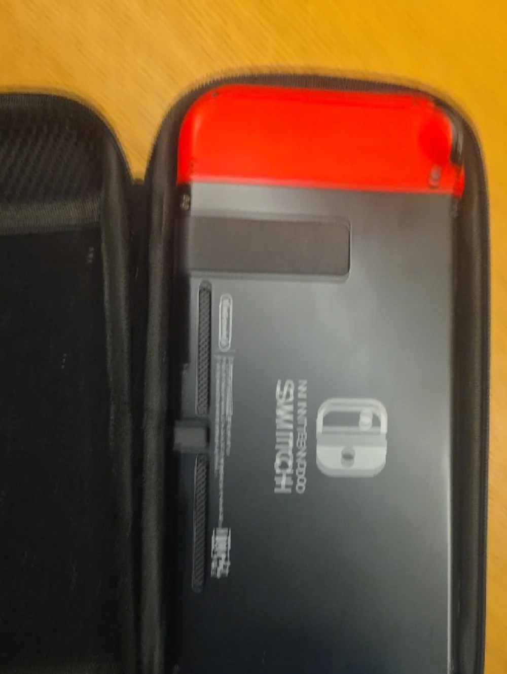 Nintendo Switch with Red and Blue Joy-Con Controllers